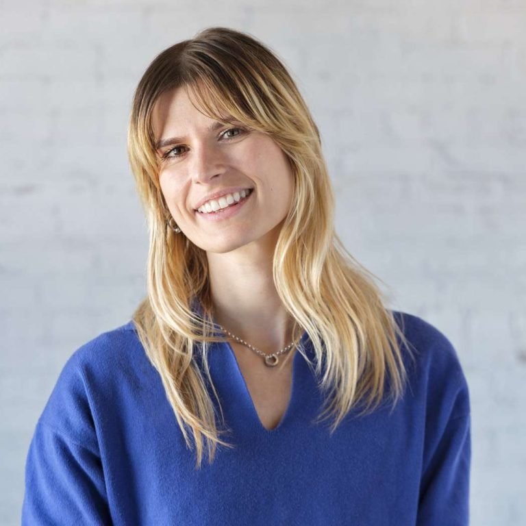 Smiling woman in blue sweater