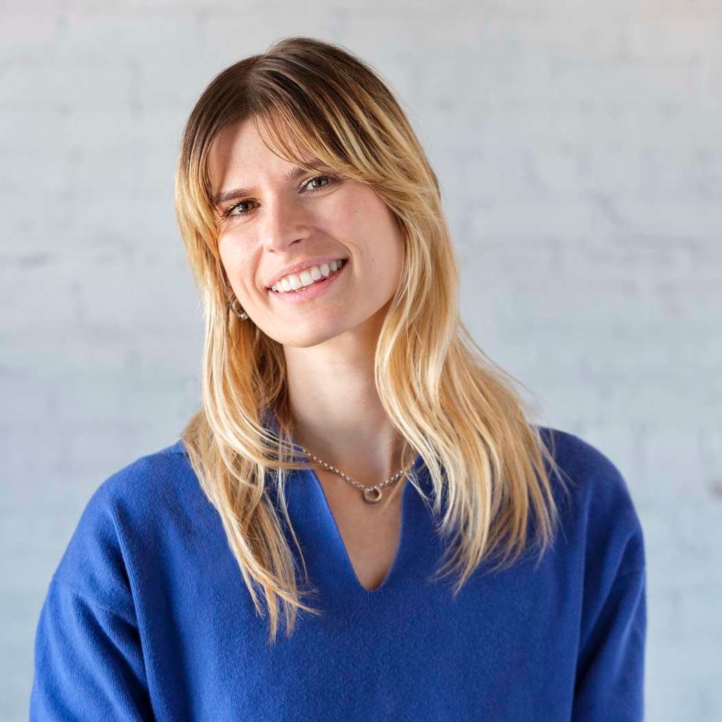 Smiling woman in blue sweater